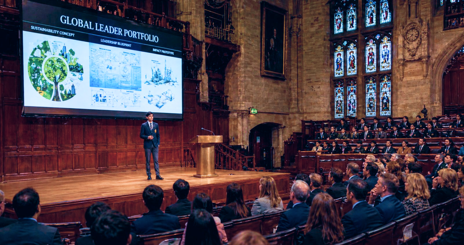 Student presenting a global leader portfolio on stage